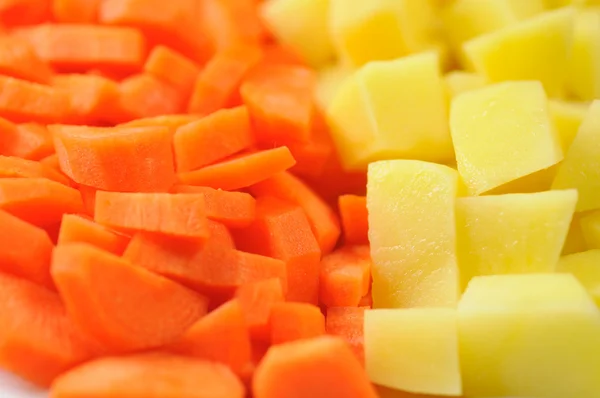 stock image Slices of raw carrots and potatoes