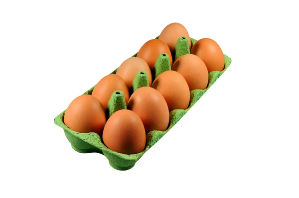 Бурые яйца в зеленом контейнере Стоковое Фото