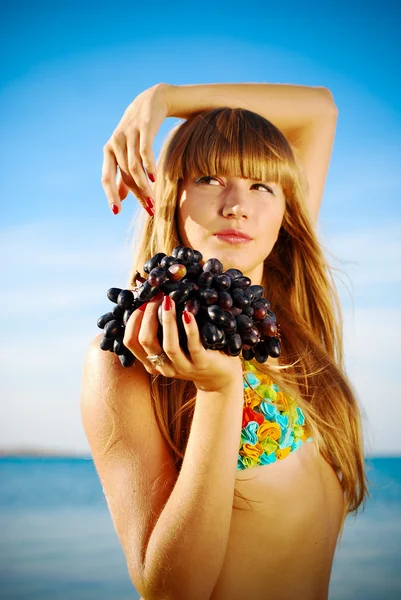 Portrait of a beautiful girl with a grape — Stock Photo, Image