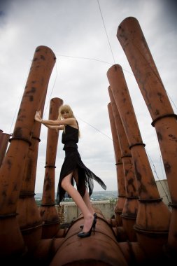 Girl outdoors on industrial background clipart