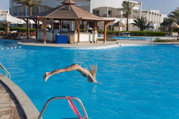 stock image Girl in a pool in motion