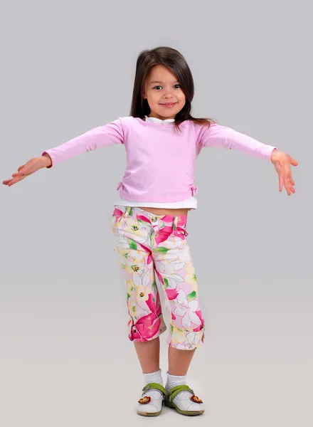 Baby girl in brightly colored clothes — Stock Photo, Image