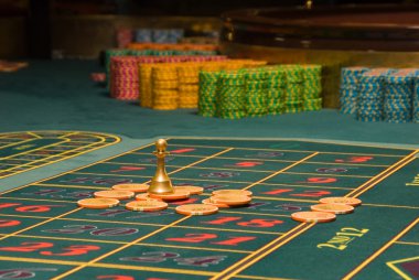 Roulette gambling chips on the table clipart