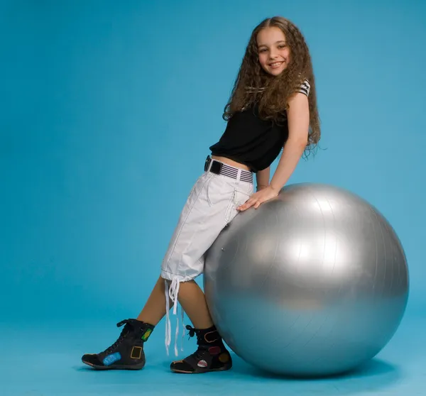 Young sweet girl with a big grey ball — Stock Photo, Image