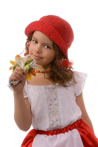 Klein meisje snuiven bloemen — Stockfoto