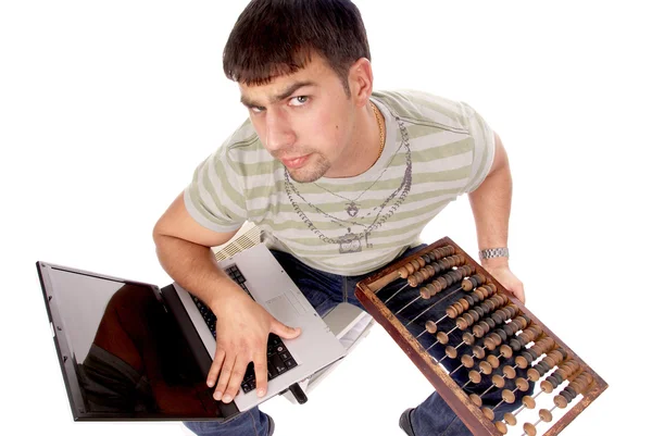Contemporary guy with laptop and countin — Stock Photo, Image