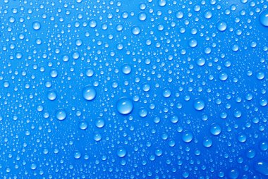 Water drops on a blue glass clipart