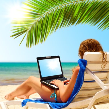 Surfing on the beach. Laptop display clipart