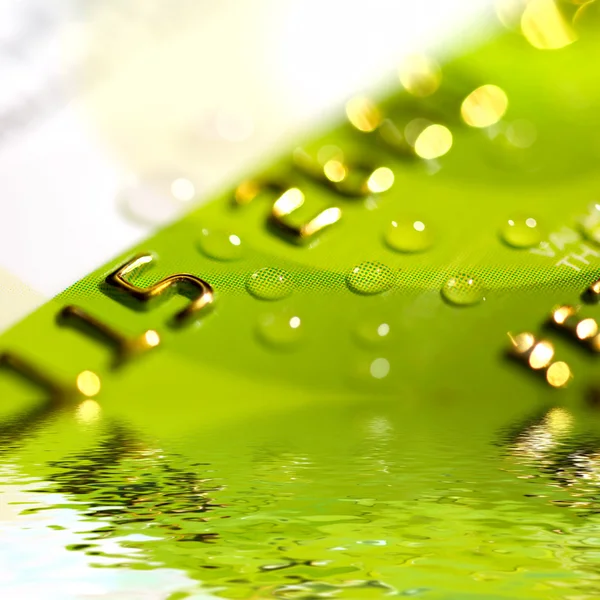 Water drops on a credit card — Stock Photo, Image