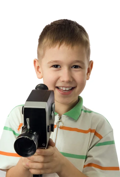 The boy with a retro movie camera — Stock Photo, Image