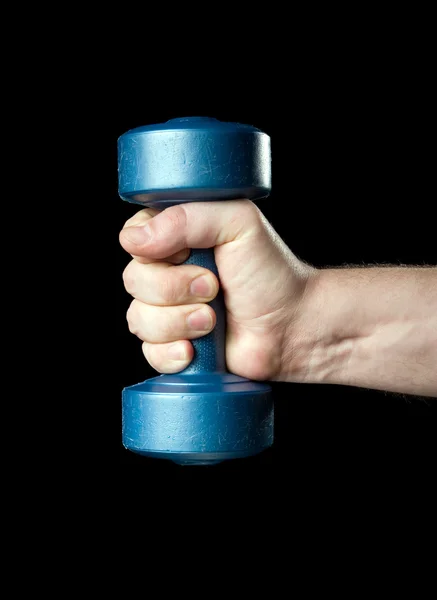 Dumbbell in a hand — Stock Photo, Image