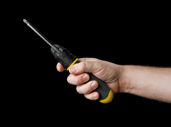 Screwdriver in hand. — Stock Photo, Image
