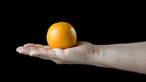 Orange on the palm. — Stock Photo, Image