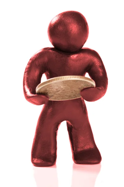 Plastelíny osoba s mincí — Stock fotografie