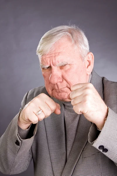 Elderly man in a pose of boxer — Stock Photo, Image