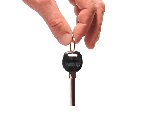 Nyckel i en hand — Stockfoto