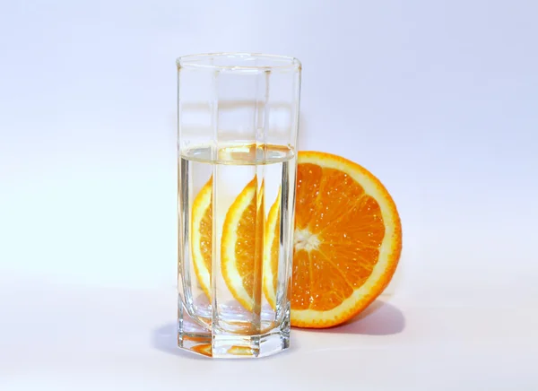 stock image Orange slice water glass