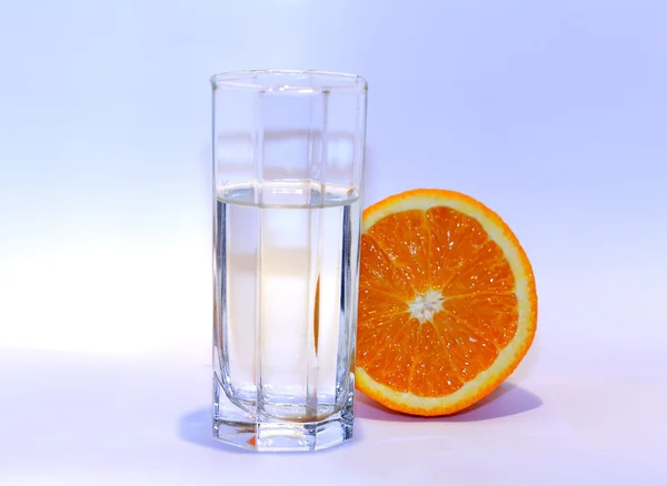 stock image Orange slice water glass