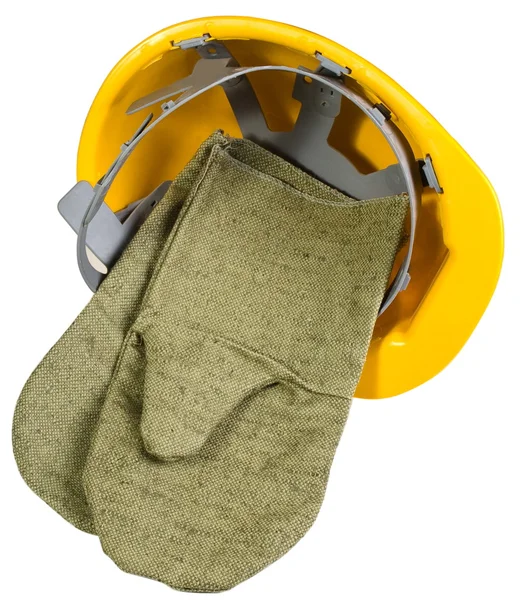 Желтый шлем с варежки, изолированные на — стоковое фото