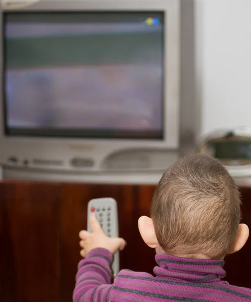 stock image The small child and TV