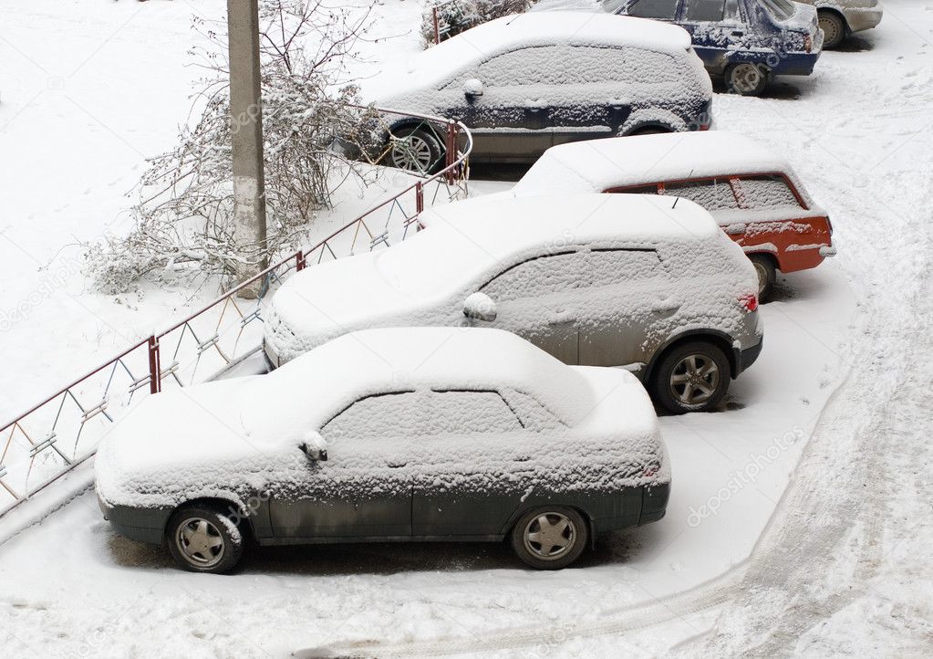 Cars covered in snow after snowstorm