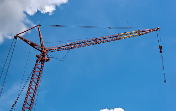 One building crane against the blue sky