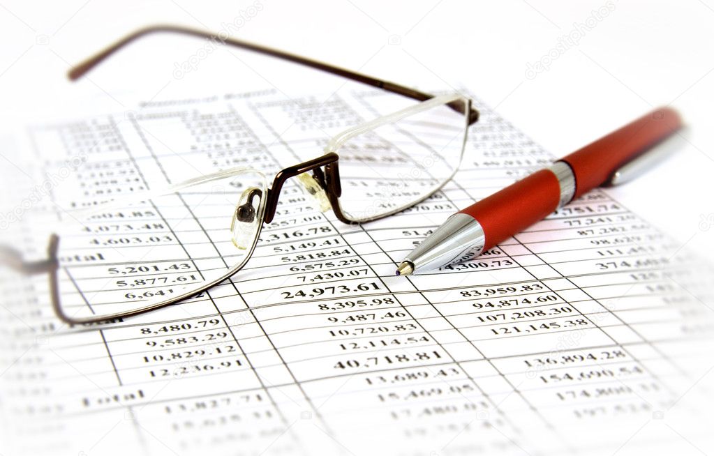 Financial report with pen and glasses