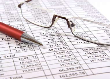 Pen and glasses on financial report clipart