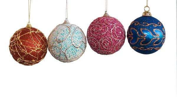 Four handicraft christmas balls on white — Stock Photo, Image