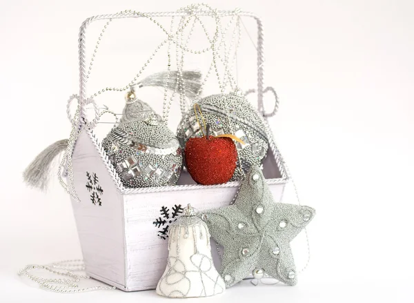 Red apple in box with silver decoration — Stock Photo, Image