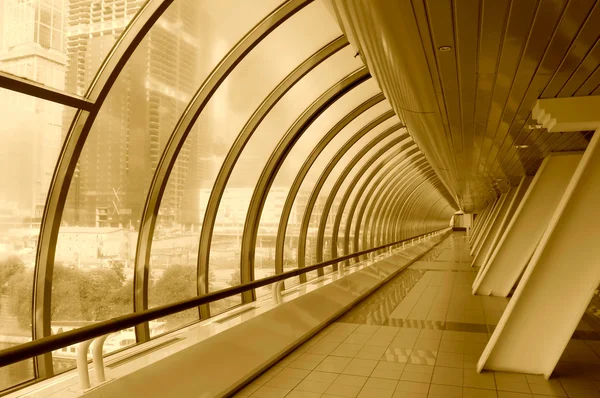 Tinted image of modern glass corridor — Stock Photo, Image