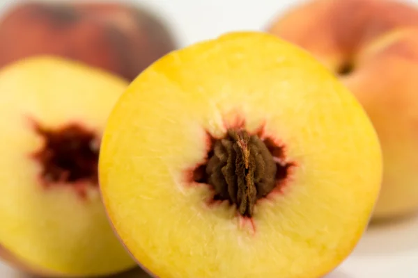 Juicy peach with pit. — Stock Photo, Image