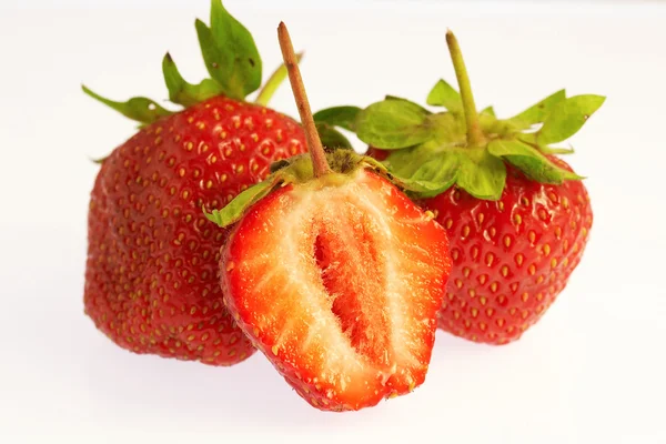 Two juicy strawberries and a half — Stock Photo, Image