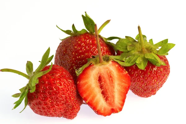 Three and half strawberries on white bac — Stock Photo, Image