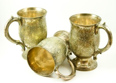 Three antique silver tankards clipart