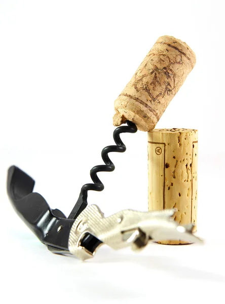 Corkscrew and two corks — Stock Photo, Image