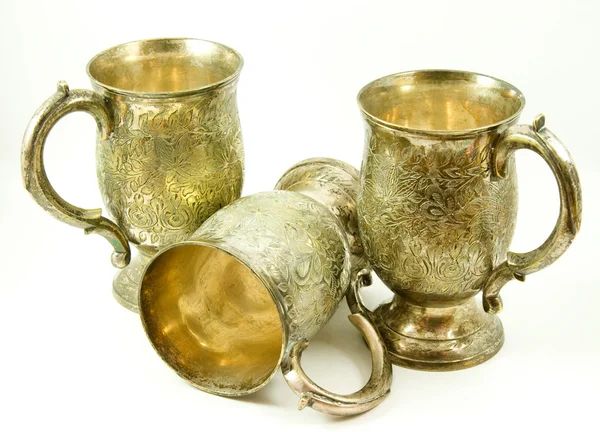Три антикварных серебряных цистерны — стоковое фото