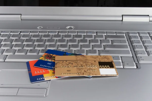 stock image Credit cards on laptop keyboard.