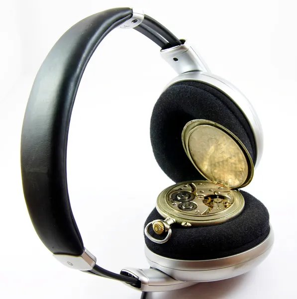 Old watch in headphones isolated — Stock Photo, Image