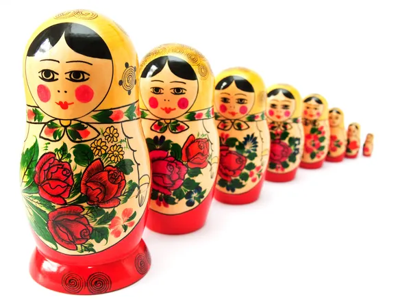 Russische Puppen in der Schlange lizenzfreie Stockbilder