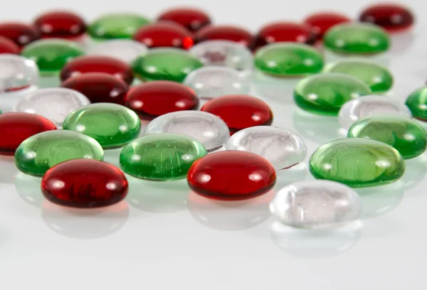 Colored glass pebbles with reflection Royalty Free Stock Images