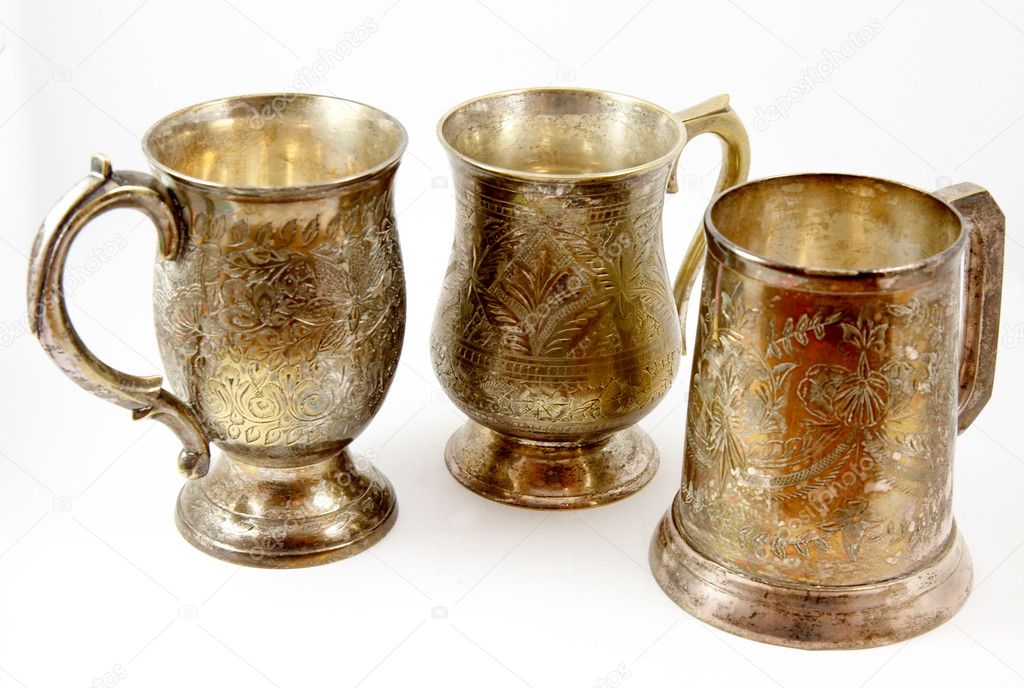 Three silver beer tankards isolated