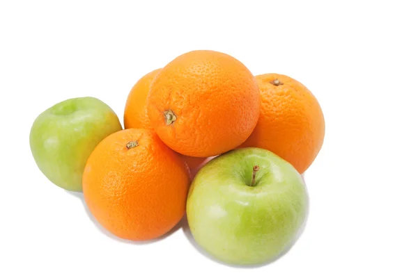 Green apples and oranges on white — Stock Photo, Image