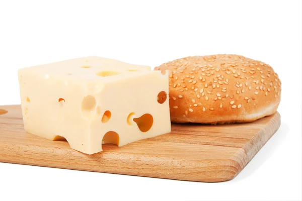 Cheese and bun with sesame — Stock Photo, Image