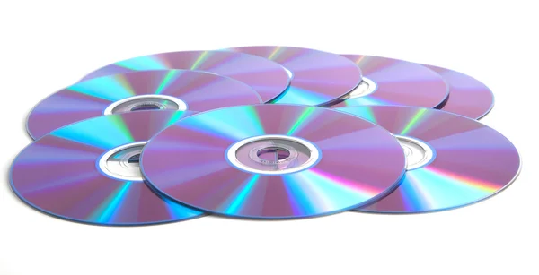 Beyaz arka plan üzerinde birçok DVD — Stok fotoğraf