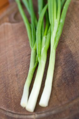 Chives on a chopping board clipart