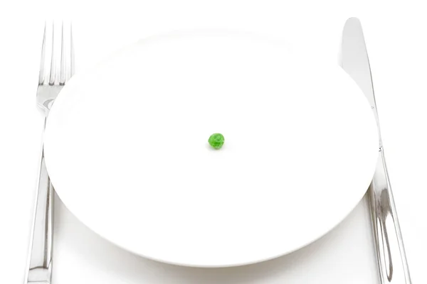 Single pea on a plate — Stock Photo, Image