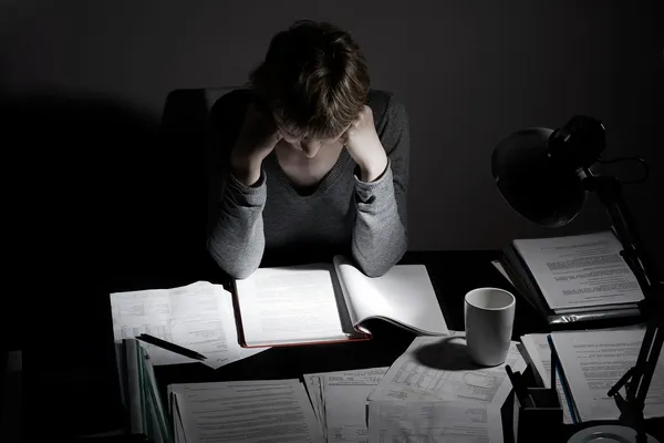 Working overhours or preparing to exam — Stock Photo, Image