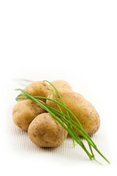 Raw potatoes with chives — Stock Photo, Image