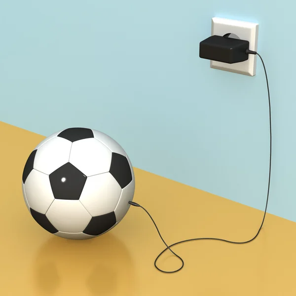 Мяч и зарядное устройство — стоковое фото